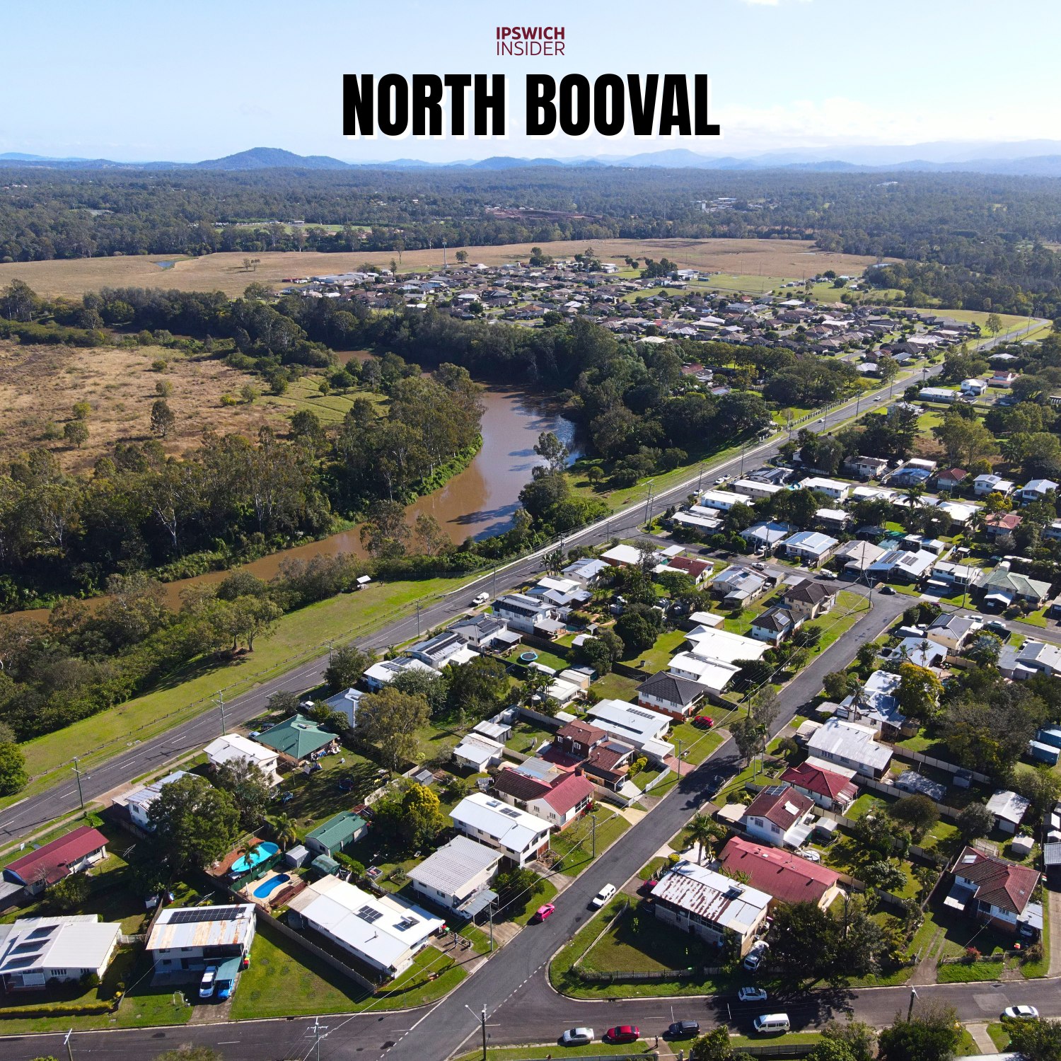 Drone photo of North Booval riverfront homes beside the Bremer River